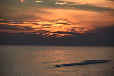 Scenic view of sea against sky at sunset