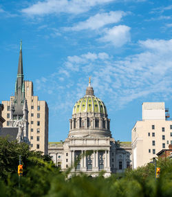 Buildings in city against sky