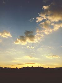 Silhouette landscape against sunset