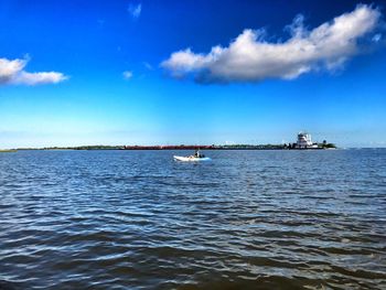 Scenic view of sea against blue sky