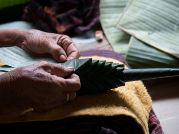 Close-up of hands working on table