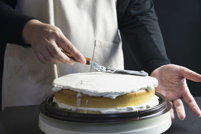 Midsection of man preparing food