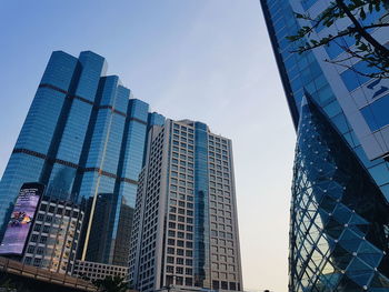 Low angle view of modern buildings against clear sky