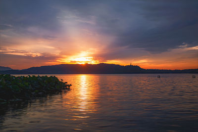 Scenic view of sea against sky during sunset