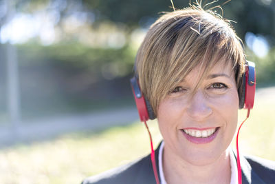 Portrait of smiling businesswoman sitting outdoors