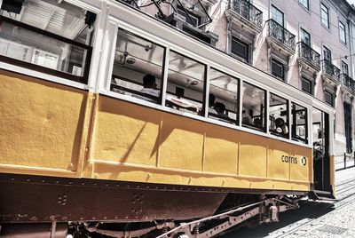 Low angle view of train against building