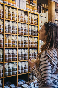 Side view of woman in store