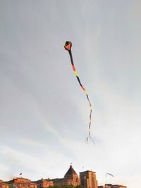 Low angle view of kite flying against sky
