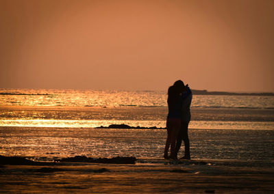Scenic view of sea at sunset
