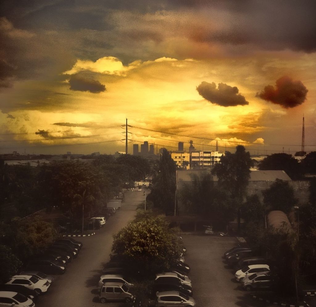 sunset, sky, transportation, car, cloud - sky, road, land vehicle, orange color, street, tree, street light, mode of transport, cloudy, dramatic sky, silhouette, cloud, the way forward, dusk, scenics, nature