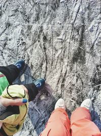 Low section of people standing on rock