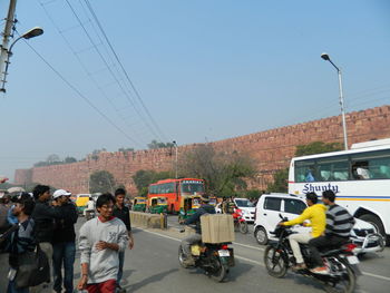 People on motorcycle against sky