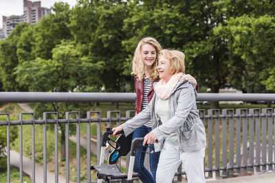 Grandmother and granddaughter strolling together