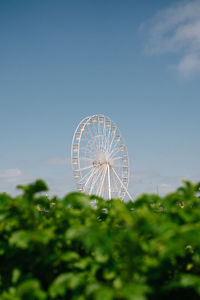 Low angle view of ferris wheel against sky