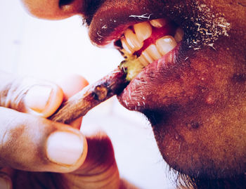 Close-up of man cleaning teeth