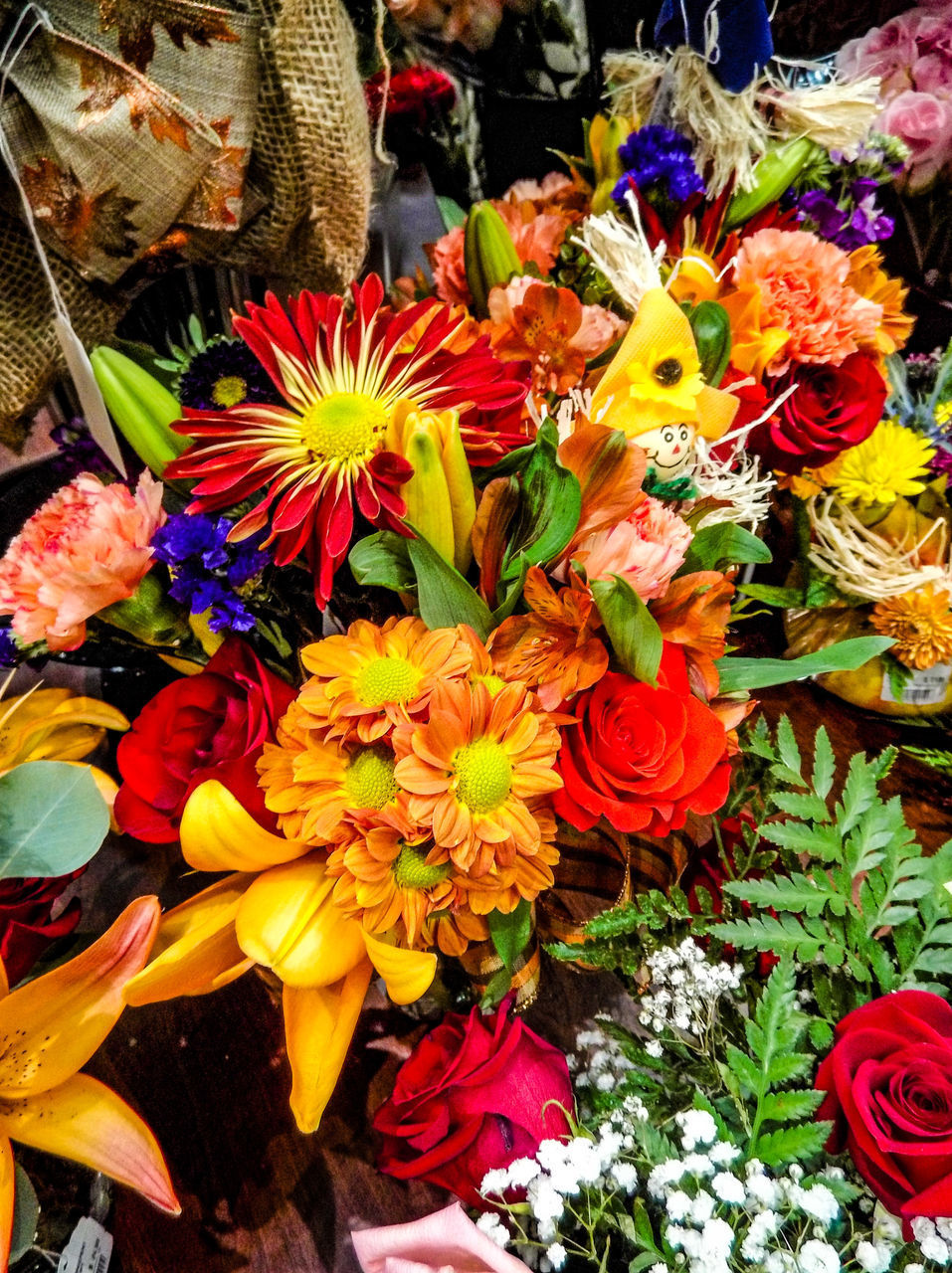 CLOSE-UP OF MULTI COLORED FLOWERS AT MARKET