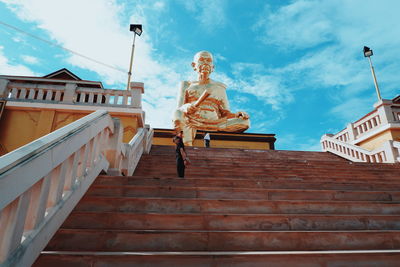 Low angle view of statue against building