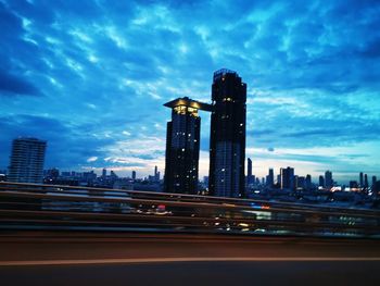 View of buildings against cloudy sky