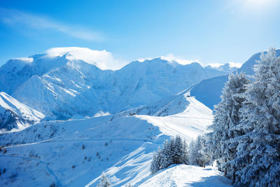 Scenic view of snowcapped mountains against sky