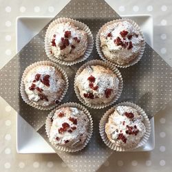 Close-up high angle view of cup cakes on table