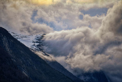 Scenic view of snowcapped mountains against sky