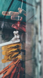 Close-up of clothespins attached to clothesline