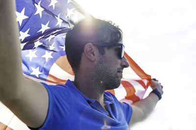 Young boy holding the american flag