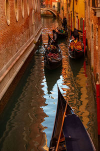 Boats moored in canal