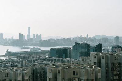 Modern buildings in city against clear sky