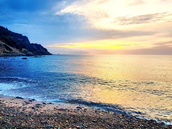 Scenic view of sea against sky during sunset