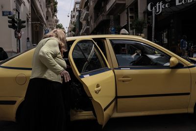 Woman standing on street in city