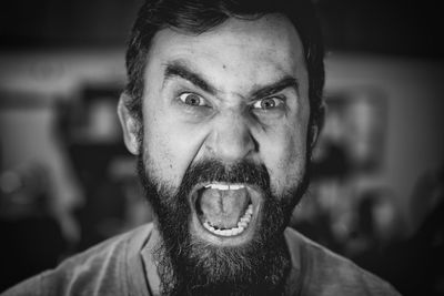 Close-up portrait of bearded man shouting