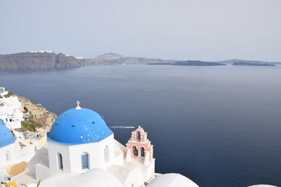 Panoramic view of sea and buildings against sky