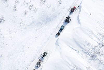 High angle view of people skiing on snowcapped mountain