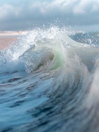 Close-up of wave splashing on sea