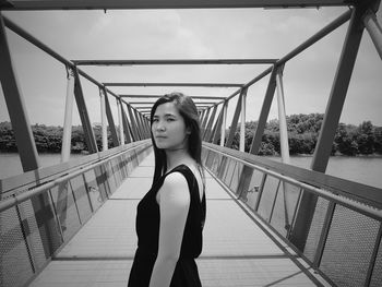 Full length of young woman against sky