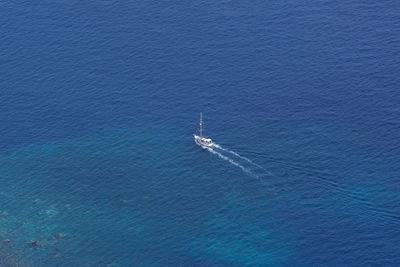 High angle view of sailboat sailing in sea