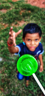 High angle portrait of boy holding outdoors