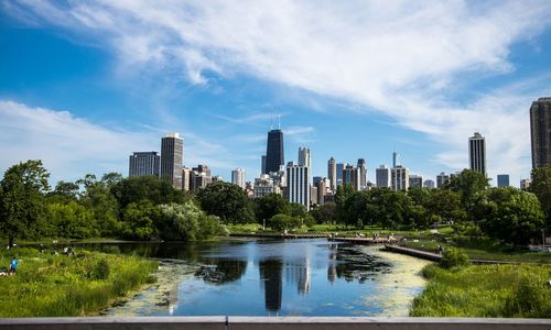 River against modern buildings in city