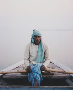 Portrait of senior man sitting on boat