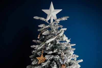 Low angle view of christmas tree against sky