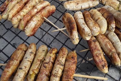 High angle view of meat on barbecue grill