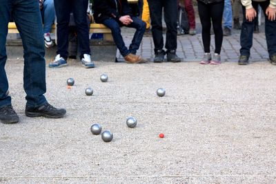 Low section of people playing soccer ball