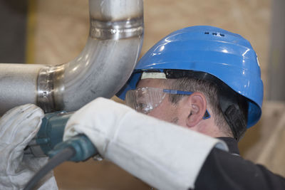 Close-up portrait of man wearing mask