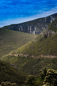 Scenic view of landscape against blue sky