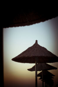 Low angle view of silhouette structure against sky