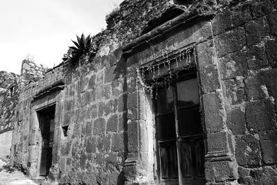 Low angle view of old building against sky