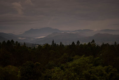 Scenic view of silhouette mountains against sky at sunset