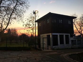 Built structure against sky at sunset