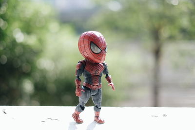 Rear view of boy standing outdoors